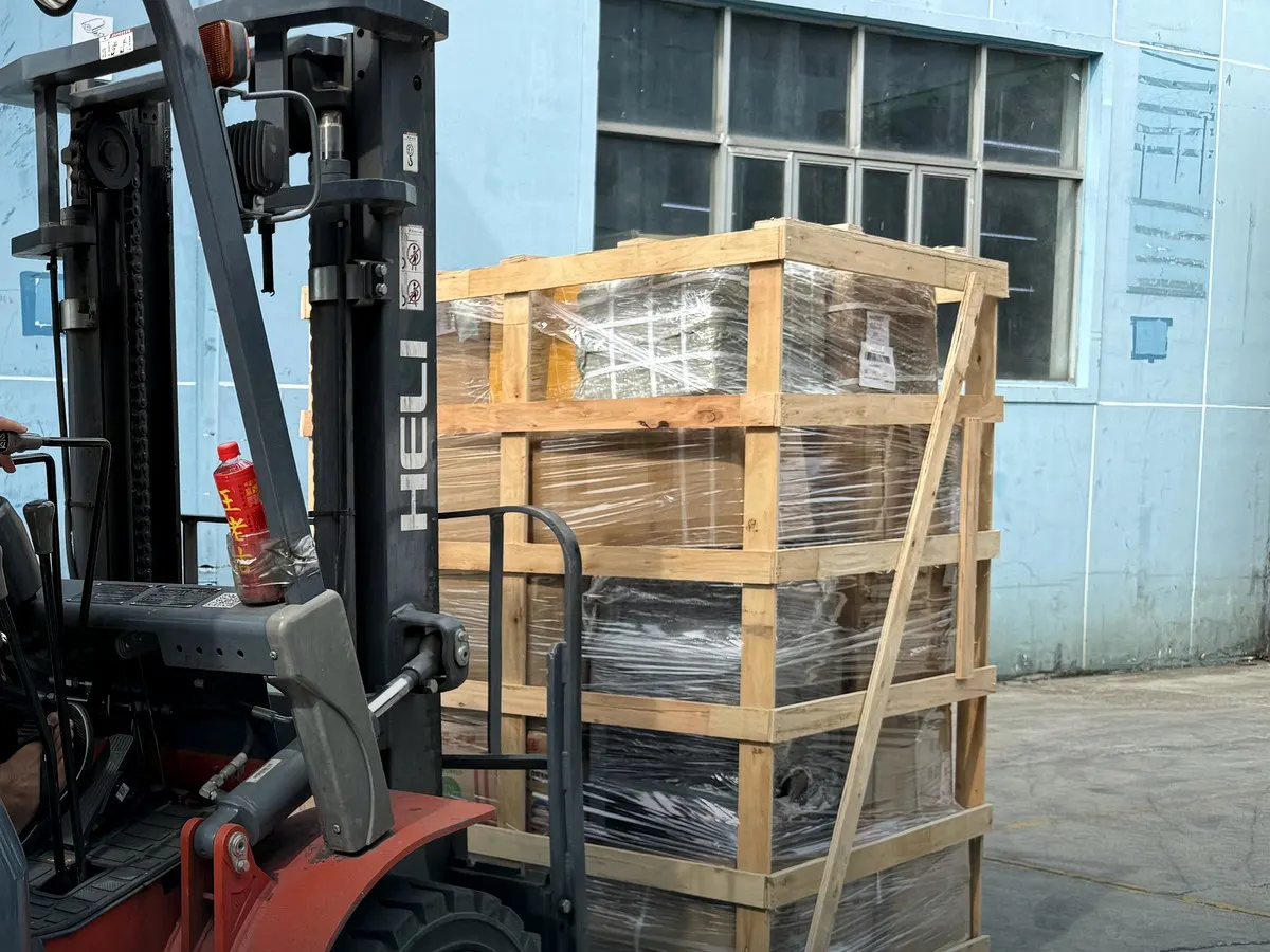 Forklift transferring a protected machinery-sized crate at BuildCargo Logistics