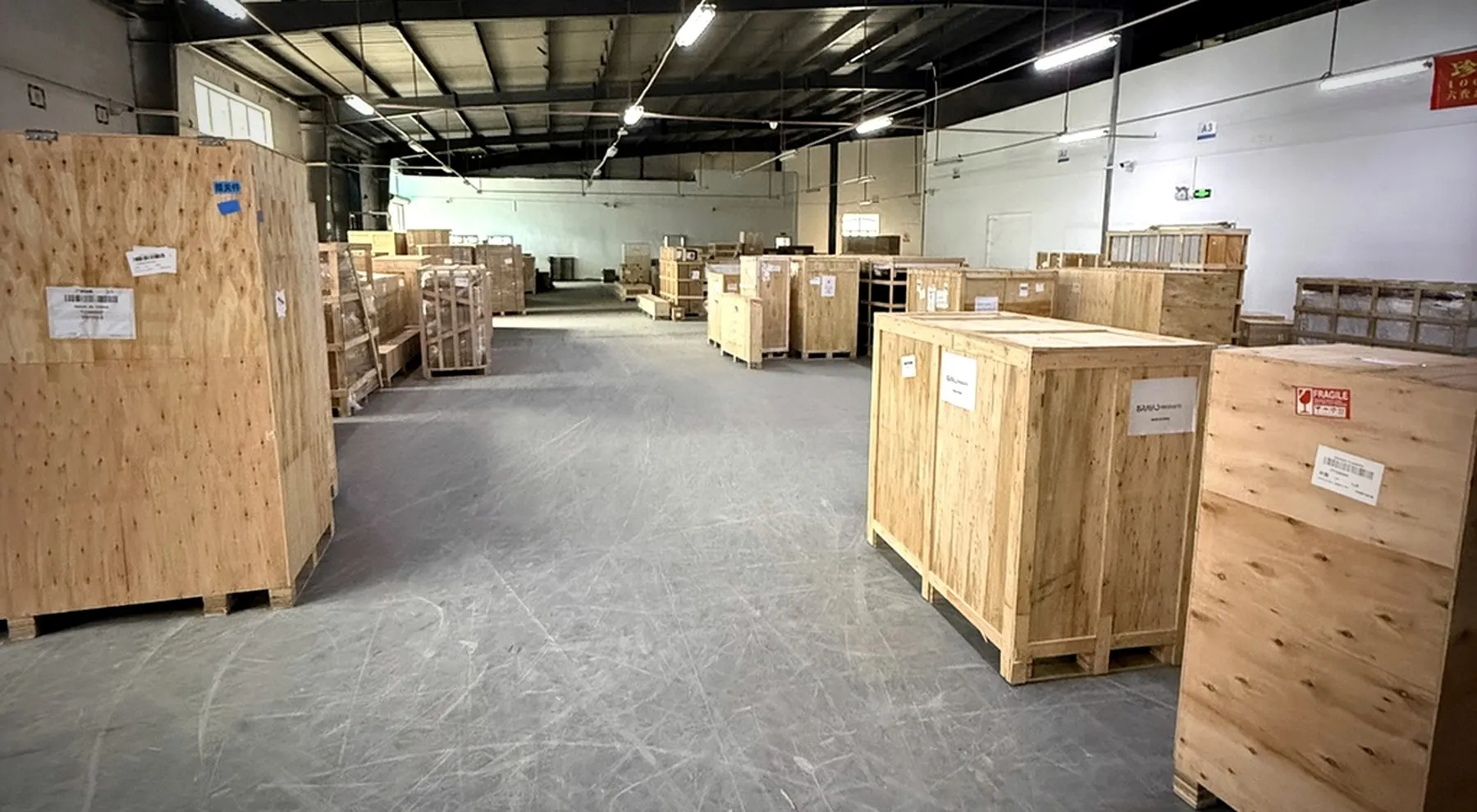 Rows of furniture and home-furnishing cargo packed in wooden crates at BuildCargo Logistics