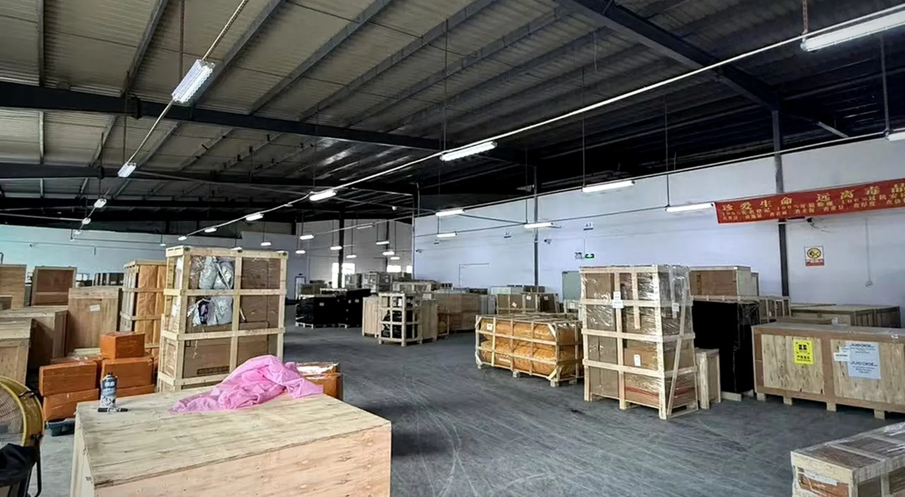 BuildCargo Logistics warehouse with rows of packed furniture and bulky cargo