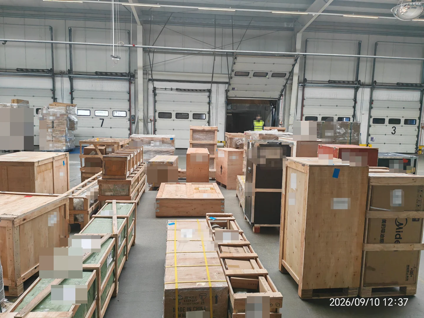Wooden crates and protected cargo beside loading bays at Buildcargo’s operated warehouse near Düsseldorf
