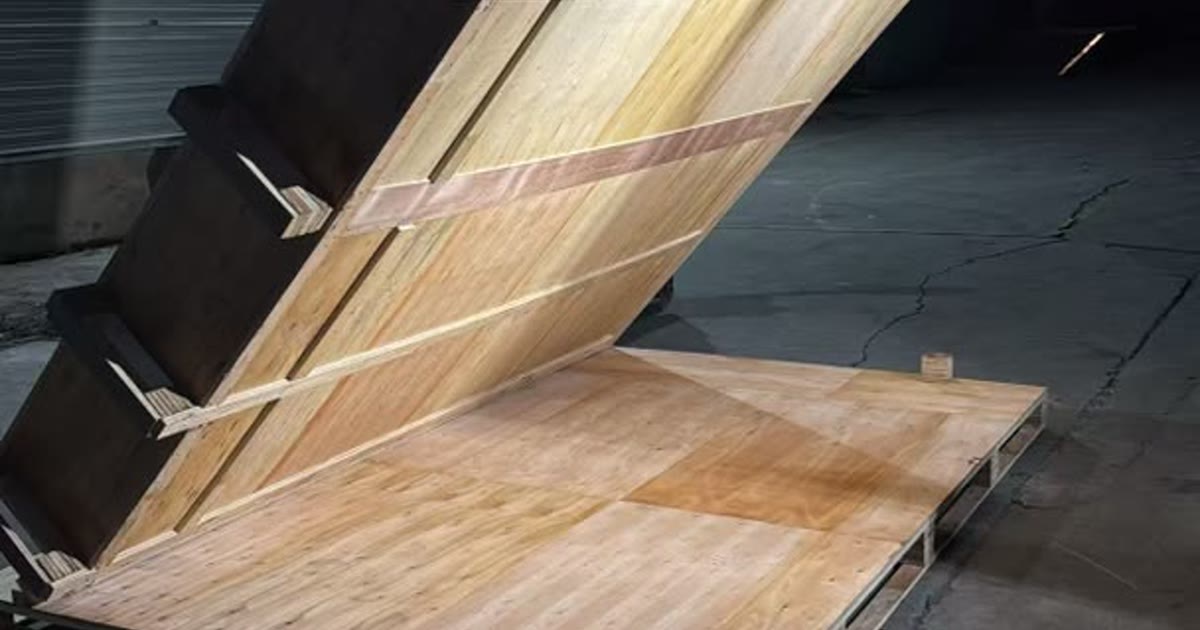 Real oversize wooden packing support rebuilt at an angle before container loading