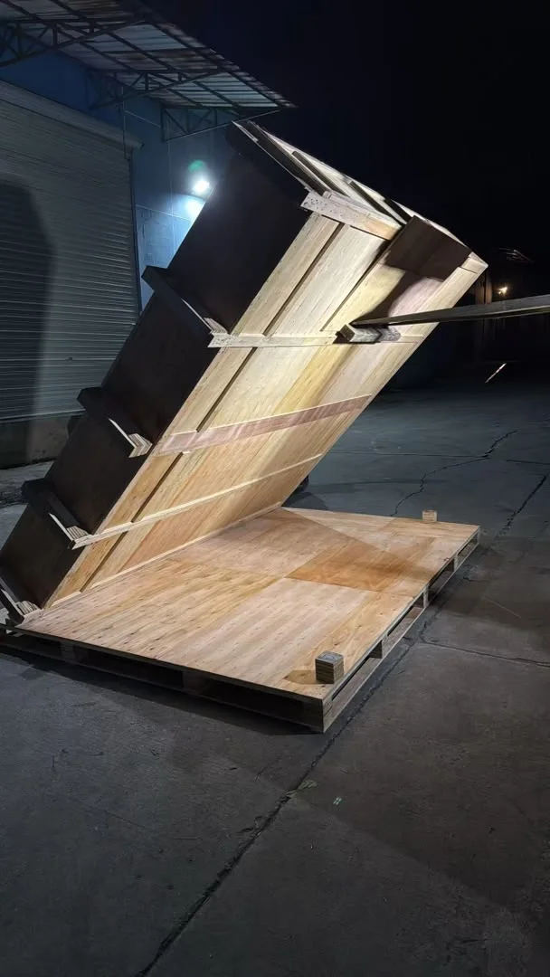 Oversize wooden packing structure secured at an angle during nighttime rework in China